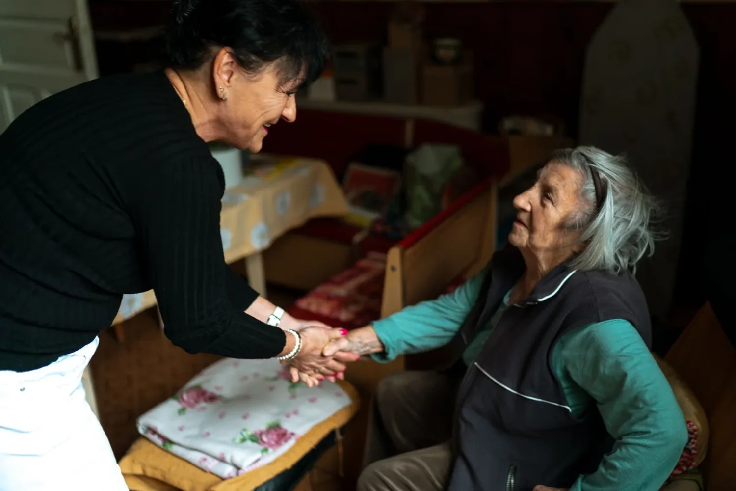 A warm conversation between a care worker and an older person